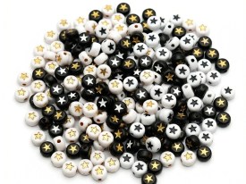 Cuentas plasticas pastilla negra estrella blanca 